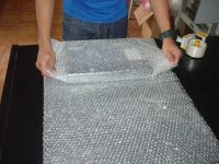 komputer diamankan bubble wrap